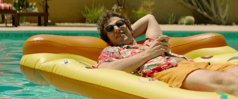 Andy Samberg in a pool floatie